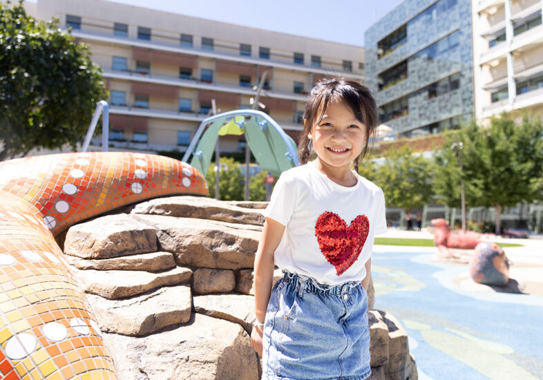 Mikayla, a heart patient, poses in the playground at the Lucile Packard Children's Hospital.