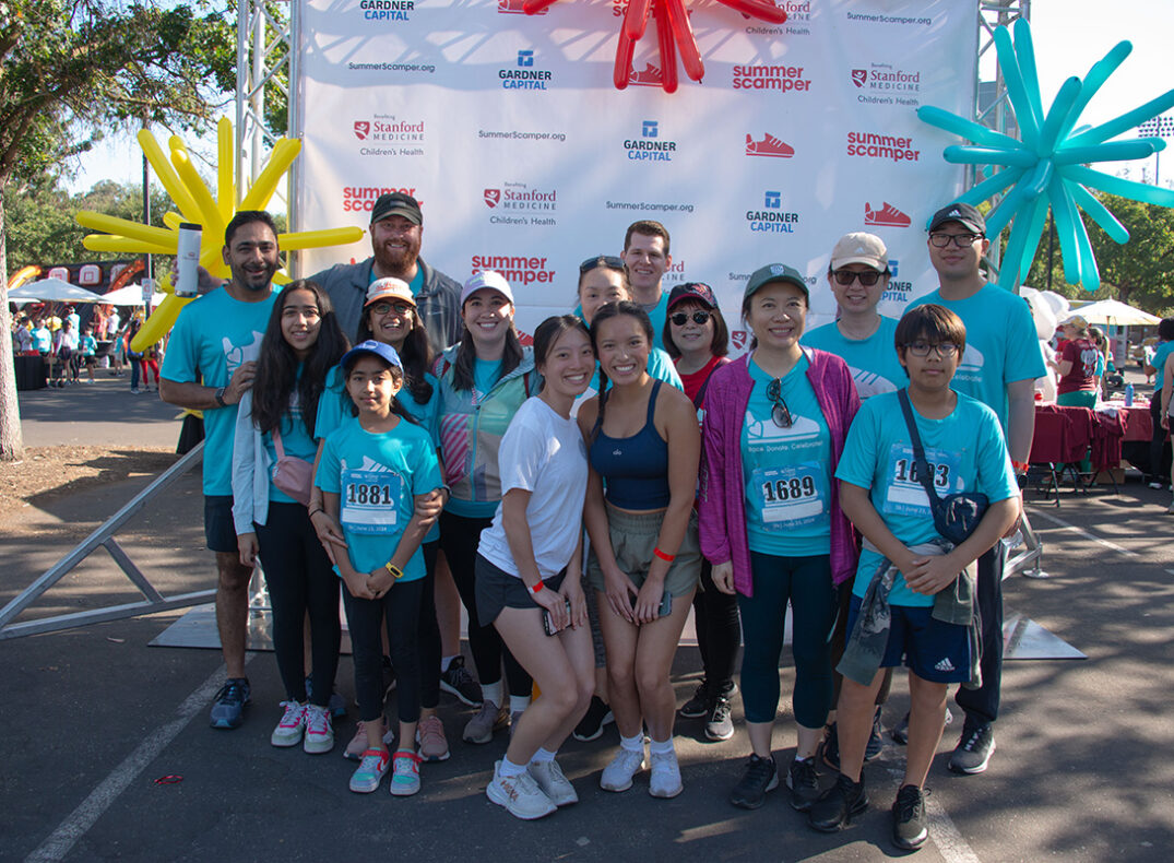 Group from CM Capital pose at Summer Scamper.